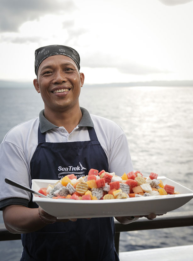 The ships purser serves breakfast